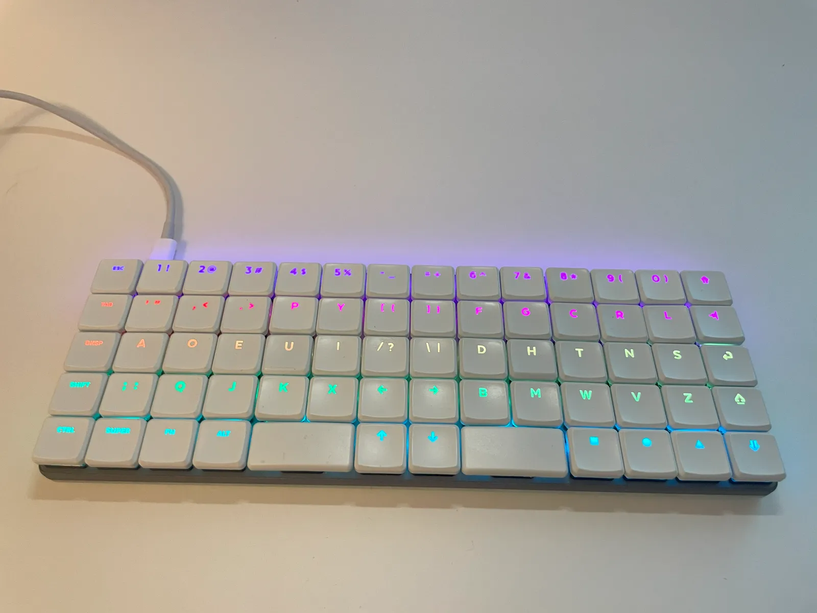 A KeBe on a white desk with its USB-C cable